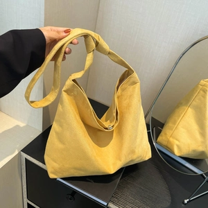Ginger yellow suede tote bag with knotted shoulder strap and magnetic closure