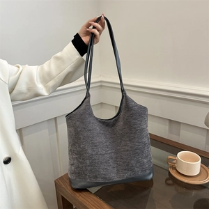 Women's large grey textured wool tote bag with leather straps for daily commute