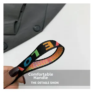 Detail of colorful jacquard woven strap with letters and high quality textile texture
