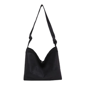Minimalist black matte large capacity tote bag with stylish knot strap detail for daily commute