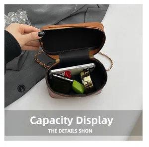 Internal view of brown quilted handbag showing space for phone and cosmetics
