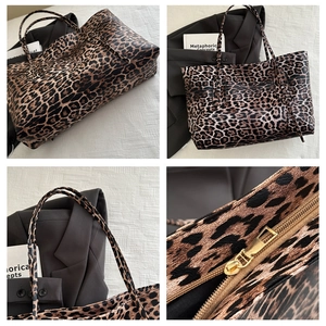 Close-up of leopard print tote bag detailing golden zipper and textured leather finish