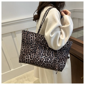 Detail view of the textured leopard print synthetic leather on this large tote bag