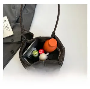 Top view showing large capacity interior of dark brown tote bag for daily essentials
