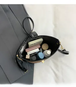Detail view of leopard print bucket bag interior showing spacious capacity for essentials