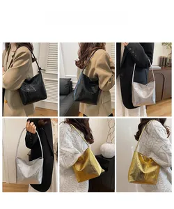 Crocodile pattern bucket bag displayed in black silver and gold colors on models