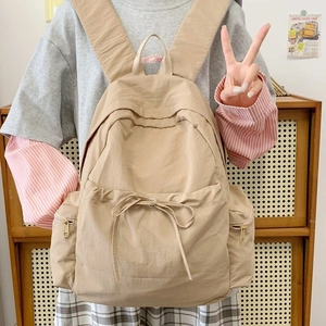 Minimalist large capacity khaki backpack with drawstring bow and gold zippers