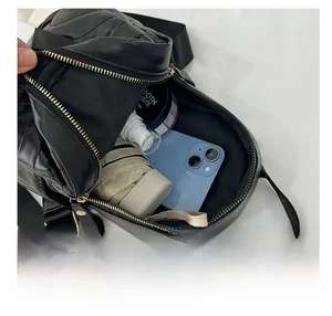 Interior view of the mini quilted crossbody bag showing storage space for phone and items