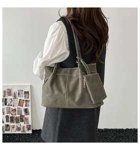 Olive green suede tote bag with white contrast stitching and matching pouch pouch charm