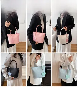 Detailed views of mini nylon tote bags in various colors featuring heart-shaped leather charms