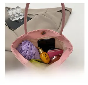 Top view of pink mini handbag showing spacious interior for phone, wallet and cosmetics