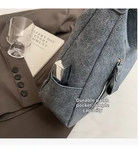 Detail of grey tote bag showing durable side pockets and premium matte texture surface