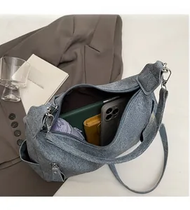 Large gray tote bag interior showing ample space for phone, tablet, and folding umbrella