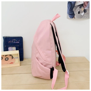 Side view of pink water-resistant nylon backpack with side pockets and breathable straps