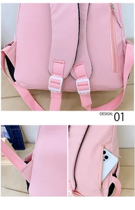 Detail view of pink nylon backpack featuring anti-theft back pocket and adjustable straps