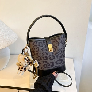 Fashionable grey leopard print bucket bag with leather handles and gold metal clasp