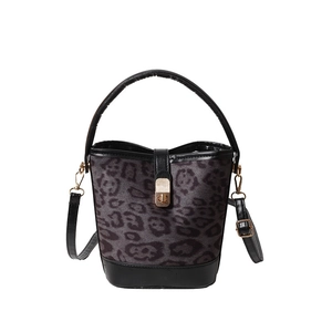Fashionable leopard print bucket bag with black leather handle and gold twist-lock closure
