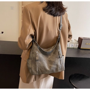 Detailed view of the large capacity retro hobo bag with vintage texture and zippers