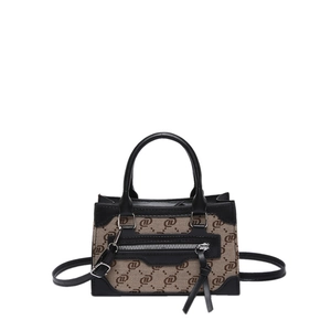 Chic brown canvas crossbody bag with vintage monogram print and black leather accents