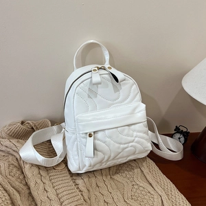 Mini white quilted backpack with wave pattern stitching and metal zipper for women
