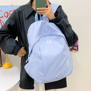 Minimalist light blue large capacity nylon backpack for girls with M embroidery