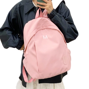 Pink high-capacity backpack with embroidered M logo for women and students in casual style
