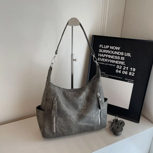 Large dark grey matte tote bag with dual zippers and crossbody strap for daily commute