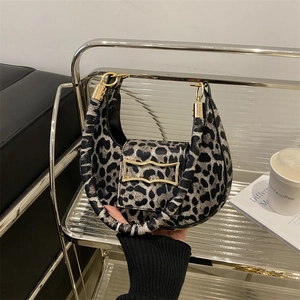 Fashionable leopard print crescent handbag with gold buckle and top handle for women