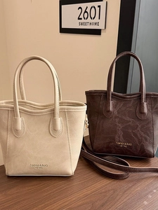 French vintage pleated bucket bag in off-white and coffee brown with shoulder straps