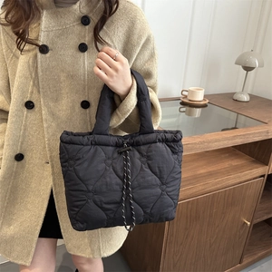 Chic black heart quilted tote bag with drawstring closure for women casual style