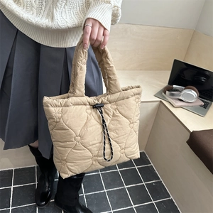 Puffy heart quilted tote bag in beige nylon with braided rope handles and large capacity