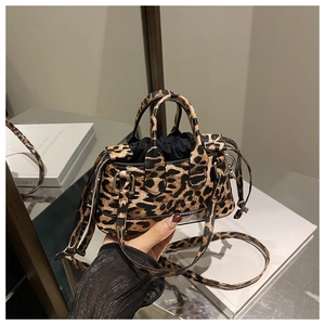 Detail of leopard print handbag showing drawstring lining and detachable shoulder strap