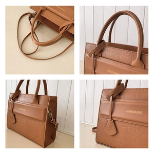 Detailed views of brown faux leather bag with crocodile pattern and golden logo accents