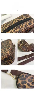 Detailed close-up of leopard print handbag with golden hardware and small coin purse
