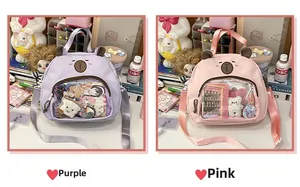 Detail view of purple and pink canvas ita-bags with clear PVC windows and bear embroidery