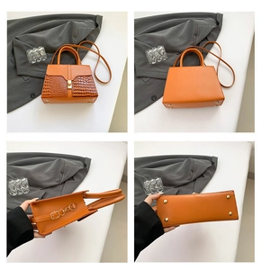 Detailed views of orange faux leather handbag with crocodile pattern and golden hardware