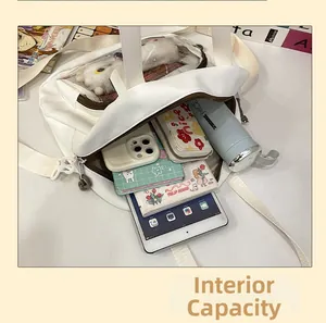 Large capacity storage detail showing white canvas bag holding an iPad and books