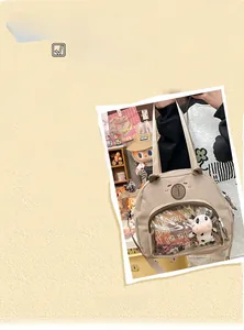 Detail view of beige canvas school bag with a clear window and cute plush cow toy inside