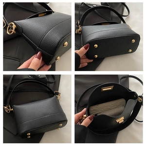Détails du cuir grainé, ferrures dorées et capacité intérieure du sac seau noir pour femmes