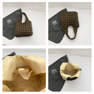 Close-up of brown quilted bubble tote bag showing internal pocket and soft fabric texture