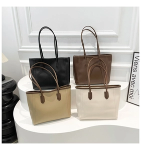 Four elegant leather tote bags in black, coffee, khaki, and cream on a white pedestal