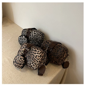 Three leopard print crossbody bag sets with round coin pouches and wide fabric straps