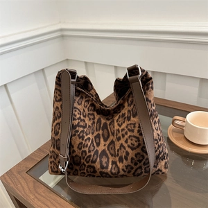 Fashionable large leopard print tote bag with adjustable brown leather shoulder strap