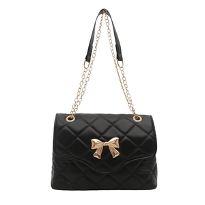 Elegant black quilted crossbody bag for women with gold bow buckle and chain strap