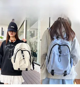 Detail of nylon backpack with drawstring front pocket and dual-color contrast options