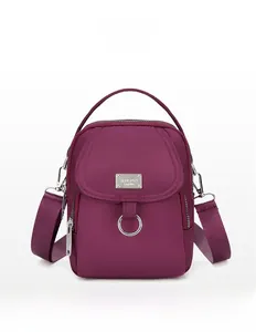 Vertical deep purple nylon mobile phone bag with multiple pockets and fabric strap