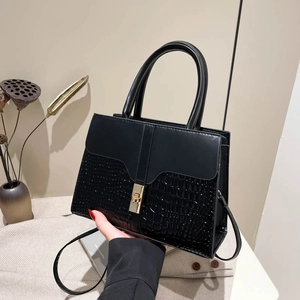 Classic black crossbody bag with faux crocodile texture and gold square metal lock