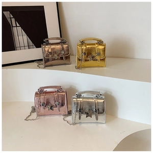 Set of mini metallic handbags with star detail and chain straps in gold pink and silver