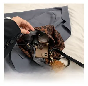 Detail showing the large interior capacity of the leopard print tote with inner pockets