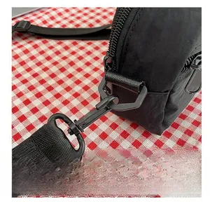 Detail of premium matte black metal hook and durable nylon strap on crossbody bag